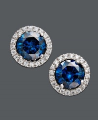 Polish your look with royalty-inspired design. Sparkling studs highlight a round-cut blue diamond (3/4 ct. t.w.) surrounded by round-cut white diamonds (1/5 ct. t.w.). Set in 14k white gold. Approximate diameter: 1/4 inch. Polish your look with royalty-inspired design. Sparkling studs highlight a round-cut blue diamond (3/4 ct. t.w.) surrounded by round-cut white diamonds (1/5 ct. t.w.). Set in 14k white gold. Approximate diameter: 1/4 inch.