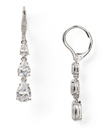 These Nadri triple earrings recall delicate sparkling droplets with a cascade of cubic zirconia crystals, finished by a rhodium plated leverback closure. These Nadri triple earrings recall delicate sparkling droplets with a cascade of cubic zirconia crystals, finished by a rhodium plated leverback closure.