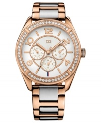 A sporty silhouette flaunts rosy color and sparkling accents on this Tommy Hilfiger watch.