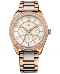 A sporty silhouette flaunts rosy color and sparkling accents on this Tommy Hilfiger watch. A sporty silhouette flaunts rosy color and sparkling accents on this Tommy Hilfiger watch.