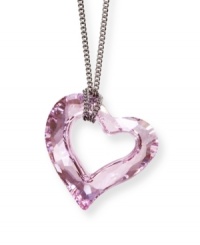 This warm-colored pendant evokes the beauty of blossom in springtime. The unique heart-shaped Swarovski crystal is created in an exclusive cut. It glitters gracefully in Rosaline crystal on a silver tone mixed metal chain. Approximate length: 15 inches. Approximate drop: 3/4 inch. This warm-colored pendant evokes the beauty of blossom in springtime. The unique heart-shaped Swarovski crystal is created in an exclusive cut. It glitters gracefully in Rosaline crystal on a silver tone mixed metal chain. Approximate length: 15 inches. Approximate drop: 3/4 inch.