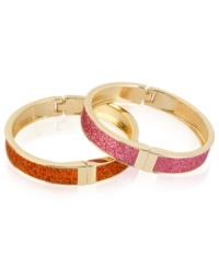 Sleek and stylish. This pair of bangle bracelets from Betsey Johnson is crafted from gold-tone mixed metal with pink and orange glitter lending them a vibrant touch. Approximate diameter: 2-1/4 inches. Sleek and stylish. This pair of bangle bracelets from Betsey Johnson is crafted from gold-tone mixed metal with pink and orange glitter lending them a vibrant touch. Approximate diameter: 2-1/4 inches.