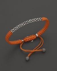 A hand braided cord bracelet in a saturated hue is adorned with Lagos' signature Caviar™ beads and finished with an adjustable closure. A hand braided cord bracelet in a saturated hue is adorned with Lagos' signature Caviar™ beads and finished with an adjustable closure.