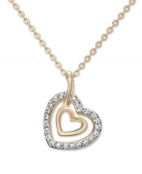 Take the classic heart pendant to a whole new level with Swarovski's chic, double heart design. Two open-cut hearts and chain crafted in gold tone mixed metal with sparkling crystal accents. Approximate length: 15 inches. Approximate drop: 1-1/4 inches. Take the classic heart pendant to a whole new level with Swarovski's chic, double heart design. Two open-cut hearts and chain crafted in gold tone mixed metal with sparkling crystal accents. Approximate length: 15 inches. Approximate drop: 1-1/4 inches.