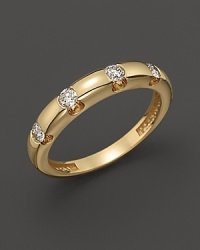 Diamonds dot a 14K yellow gold band. Diamonds dot a 14K yellow gold band.