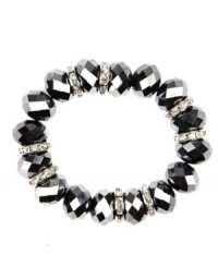 Stunning with silver tone and crystal plastic beads, Nine West's stretch bracelet also boasts silver tone rondelles with clear crystal accents. Bracelet stretches to fit wrist. Crafted in imitation rhodium-plated mixed metal. Approximate diameter: 2 inches. Stunning with silver tone and crystal plastic beads, Nine West's stretch bracelet also boasts silver tone rondelles with clear crystal accents. Bracelet stretches to fit wrist. Crafted in imitation rhodium-plated mixed metal. Approximate diameter: 2 inches.