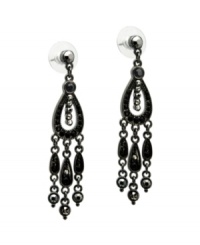 Take it to the edge in daring drops with bold color. GUESS chandelier earrings feature glittering black crystals set in hematite tone mixed metal. Approximate drop: 1-1/2 inches. Take it to the edge in daring drops with bold color. GUESS chandelier earrings feature glittering black crystals set in hematite tone mixed metal. Approximate drop: 1-1/2 inches.