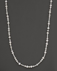 Mixed-size fresh water pearl necklace with 14 Kt. gold bead accents. Mixed-size fresh water pearl necklace with 14 Kt. gold bead accents.