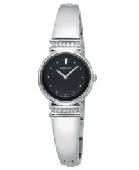 Time to dazzle: Crystals add sparkle to this bangle-style Seiko watch. Stainless steel bracelet and round case. Top and bottom of case crystallized with Swarovski elements. Black dial features crystal elements by Swarovski at indices, silvertone hands and logo. Quartz movement. Water resistant to 30 meters. Three-year limited warranty. Time to dazzle: Crystals add sparkle to this bangle-style Seiko watch. Stainless steel bracelet and round case. Top and bottom of case crystallized with Swarovski elements. Black dial features crystal elements by Swarovski at indices, silvertone hands and logo. Quartz movement. Water resistant to 30 meters. Three-year limited warranty.