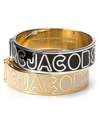 Bold logo lettering adorns this signature bangle from MARC BY MARC JACOBS. Bold logo lettering adorns this signature bangle from MARC BY MARC JACOBS.