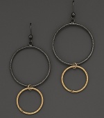Striking, elegant hoops of black and yellow gold. By Lana.