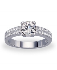 Dazzle them all with this stunning ring by Swarovski. A prominent crystal at center shines even brighter with the help of accent crystals at either side on band. Crafted in rhodium-plated mixed metal. Sizes 8 and 9. Dazzle them all with this stunning ring by Swarovski. A prominent crystal at center shines even brighter with the help of accent crystals at either side on band. Crafted in rhodium-plated mixed metal. Sizes 8 and 9.