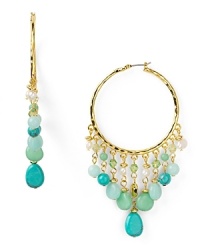 Crafted of cascading turquoise beads and fresh water pearls, Lauren Ralph Lauren's hoop earrings are an impactful accessory. Set them against a clean, classic look for a standout contrast. Crafted of cascading turquoise beads and fresh water pearls, Lauren Ralph Lauren's hoop earrings are an impactful accessory. Set them against a clean, classic look for a standout contrast.