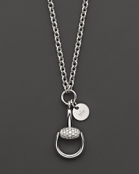 Glittering diamonds stud this 18K white gold horsebit pendant. Glittering diamonds stud this 18K white gold horsebit pendant.