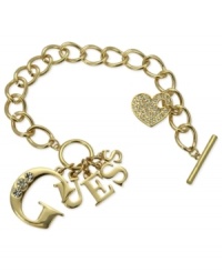 Strike up the brand. This logo bracelet from GUESS is crafted from gold-tone mixed metal with glass crystal accents adding a lustrous touch. Item comes packaged in a signature GUESS Gift Box. Approximate length: 7-1/2 inches. Approximate drop: 1 inch. Approximate diameter: 1-1/2 inches. Strike up the brand. This logo bracelet from GUESS is crafted from gold-tone mixed metal with glass crystal accents adding a lustrous touch. Item comes packaged in a signature GUESS Gift Box. Approximate length: 7-1/2 inches. Approximate drop: 1 inch. Approximate diameter: 1-1/2 inches.
