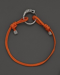 Eastern elements inform John Hardy's dragon head bracelet. It features a cotton cord band with an adjustable sliding closure. Eastern elements inform John Hardy's dragon head bracelet. It features a cotton cord band with an adjustable sliding closure.