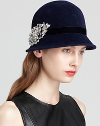 Done up in soft velour, this '20s-inspired cloche from Kathy Jeanne makes a sparkly statement with its removable crystal pin. Done up in soft velour, this '20s-inspired cloche from Kathy Jeanne makes a sparkly statement with its removable crystal pin.