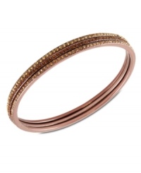 Subtle chic. Givenchy's bangle bracelet, crafted from rose gold-tone mixed metal, dazzles with light Colorado and smoked topaz tone glass accents. Approximate diameter: 2-1/2 inches. Subtle chic. Givenchy's bangle bracelet, crafted from rose gold-tone mixed metal, dazzles with light Colorado and smoked topaz tone glass accents. Approximate diameter: 2-1/2 inches.