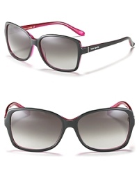 Stylish oversized rectangle sunglasses with a contrast interior for a fun pop of color. Stylish oversized rectangle sunglasses with a contrast interior for a fun pop of color.