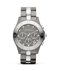 MARC BY MARC JACOBS makes a metallic statement with this dual tone watch. Crated of stainless steel with gunmetal and silver glitz accents, it's a super striking choice. MARC BY MARC JACOBS makes a metallic statement with this dual tone watch. Crated of stainless steel with gunmetal and silver glitz accents, it's a super striking choice.