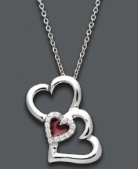 Say it from the heart. Treasured Hearts' stunning pendant features three, open-cut hearts in sterling silver. Center heart features a red enamel center surrounded by sparkling, round-cut diamonds (1/10 ct. t.w.). Approximate length: 18 inches. Approximate drop: 1 inch. Say it from the heart. Treasured Hearts' stunning pendant features three, open-cut hearts in sterling silver. Center heart features a red enamel center surrounded by sparkling, round-cut diamonds (1/10 ct. t.w.). Approximate length: 18 inches. Approximate drop: 1 inch.