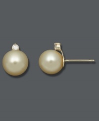Polish and shine combine. These stunning studs highlight golden cultured South Sea pearls (8-9 mm) topped with sparkling, round-cut diamonds (1/10 ct. t.w.). Crafted in 14k gold. Approximate diameter: 1/3 inch. Polish and shine combine. These stunning studs highlight golden cultured South Sea pearls (8-9 mm) topped with sparkling, round-cut diamonds (1/10 ct. t.w.). Crafted in 14k gold. Approximate diameter: 1/3 inch.