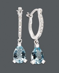 An elegant spin on the traditional hoop. Vibrant aquamarine teardrops (2 ct. t.w.) dangle dramatically from a 14k white gold hoop setting dusted in diamond accents. Approximate drop: 1/4 inch. An elegant spin on the traditional hoop. Vibrant aquamarine teardrops (2 ct. t.w.) dangle dramatically from a 14k white gold hoop setting dusted in diamond accents. Approximate drop: 1/4 inch.