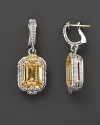 Sterling silver earrings set with faceted white sapphires and canary crystal. By Judith Ripka.