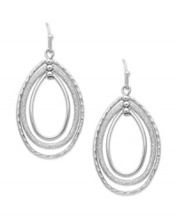 Fashion that pulls you in. These orbital earrings from Charter Club feature an oval silhouette with dangling hoops. Crafted in silver tone mixed metal. Approximate drop: 1-3/4 inches. Fashion that pulls you in. These orbital earrings from Charter Club feature an oval silhouette with dangling hoops. Crafted in silver tone mixed metal. Approximate drop: 1-3/4 inches.