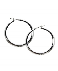 Make a style statement in the brand you love. GUESS hoops feature the company logo engraved on the surface. Set in silver tone mixed metal with jet plating. Approximate diameter: 1-1/2 inches. Make a style statement in the brand you love. GUESS hoops feature the company logo engraved on the surface. Set in silver tone mixed metal with jet plating. Approximate diameter: 1-1/2 inches.