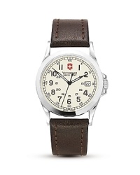 A leather strap lends classic style to this analog quartz watch from Victorinox. Features military time, low battery indicator, date window, luminous hands. A leather strap lends classic style to this analog quartz watch from Victorinox. Features military time, low battery indicator, date window, luminous hands.