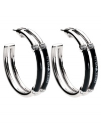 Chic Italian style for everyday, by Emporio Armani. Logo-embossed earrings in stainless steel and black enamel with crystal accents. Approximate diameter: 1 inch. Chic Italian style for everyday, by Emporio Armani. Logo-embossed earrings in stainless steel and black enamel with crystal accents. Approximate diameter: 1 inch.