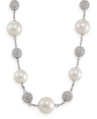 Carolee creates an icy illusion with this stunning necklace. Glass pearls and crystal-accented fireballs alternate on a chain crafted of imitation rhodium-plated mixed metal. Approximate length: 16 inches + 2-inch extender. Carolee creates an icy illusion with this stunning necklace. Glass pearls and crystal-accented fireballs alternate on a chain crafted of imitation rhodium-plated mixed metal. Approximate length: 16 inches + 2-inch extender.