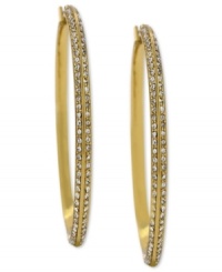 Go big and bold. These hoop earrings from Vince Camuto are crafted from gold tone mixed metal and feature rows of clear glass accents adorning the outside. Approximate drop: 3-1/4 inches. Go big and bold. These hoop earrings from Vince Camuto are crafted from gold tone mixed metal and feature rows of clear glass accents adorning the outside. Approximate drop: 3-1/4 inches.