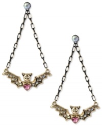 Rule the night. These nocturnal earrings from Betsey Johnson feature a bat wing design embellished with pink and clear crystal accents. Crafted in antiqued gold tone mixed metal. Approximate drop: 3 inches. Rule the night. These nocturnal earrings from Betsey Johnson feature a bat wing design embellished with pink and clear crystal accents. Crafted in antiqued gold tone mixed metal. Approximate drop: 3 inches.
