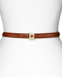Tory Burch's logo-decked skinny leather belt adds subtle hit of luxe. For easy chic, loop the understated style through dark denim and simple separates. Tory Burch's logo-decked skinny leather belt adds subtle hit of luxe. For easy chic, loop the understated style through dark denim and simple separates.