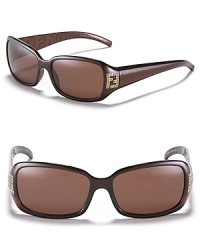 Sporty shades get a glam touch with rhinestone Fendi logo detail at temples. Sporty shades get a glam touch with rhinestone Fendi logo detail at temples.