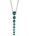 Teal appeal. This Y-shaped necklace from GUESS is crafted from hematite-tone mixed metal with glass crystal stones putting on a dazzling display. Item comes packaged in a signature GUESS Gift Box. Approximate length: 18 inches + 2-inch extender. Approximate drop: 4 inches.