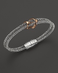 Rhodium and 18K white gold strands are detailed with gleaming 18K rose gold links on this timelessly modern Di MODOLO bracelet. Rhodium and 18K white gold strands are detailed with gleaming 18K rose gold links on this timelessly modern Di MODOLO bracelet.