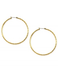 Embellished elegance. Anne Klein adds glass accents to these hoop earrings crafted from gold-tone mixed metal to stunning effect. Approximate diameter: 2 inches. Embellished elegance. Anne Klein adds glass accents to these hoop earrings crafted from gold-tone mixed metal to stunning effect. Approximate diameter: 2 inches.