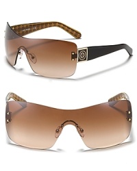 Protect your peepers while looking Tory Burch beautiful. These wrap-around shades are a striking choice. Protect your peepers while looking Tory Burch beautiful. These wrap-around shades are a striking choice.