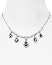 This delicate Carolee necklace styles your look with effortless elegance, set in silver plated metal and accented by mesmerizing teardrop-shaped crystals. This delicate Carolee necklace styles your look with effortless elegance, set in silver plated metal and accented by mesmerizing teardrop-shaped crystals.