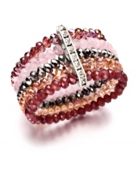 Nothing says femininity like pretty pink hues and a touch of sparkle. This romantic cuff by Ali Khan features five rows of sparkling pink glass beads with a row of rhinestone accents. Bracelet stretches to fit wrist. Approximate diameter: 2 inches. Nothing says femininity like pretty pink hues and a touch of sparkle. This romantic cuff by Ali Khan features five rows of sparkling pink glass beads with a row of rhinestone accents. Bracelet stretches to fit wrist. Approximate diameter: 2 inches.