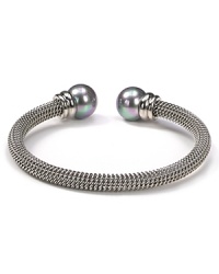 Majorica's steely gray bangle exudes cool confidence. Solo or stacked, wear yours at cocktail hour to give night time looks a strong spin. Majorica's steely gray bangle exudes cool confidence. Solo or stacked, wear yours at cocktail hour to give night time looks a strong spin.
