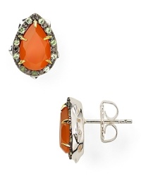 The garden serves as inspiration for this pair of thorn-shaped studs from Elizabeth and James, accented by striking carnelian and garnet stones. The garden serves as inspiration for this pair of thorn-shaped studs from Elizabeth and James, accented by striking carnelian and garnet stones.
