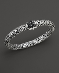 A pavé clasp of black sapphires anchors intricately woven sterling silver. A pavé clasp of black sapphires anchors intricately woven sterling silver.