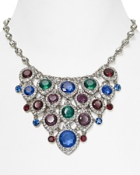A true statement piece: this bold bib necklace from ABS by Allen Schwartz is an instant outfit-maker, crafted of plated metal with a cascade of colored gemstones. A true statement piece: this bold bib necklace from ABS by Allen Schwartz is an instant outfit-maker, crafted of plated metal with a cascade of colored gemstones.