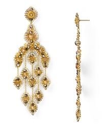 An ornate cascade formed from beautiful 14-karat gold, Swarovski crystals, and topaz accents, Miguel Ases' gleaming chandelier earrings are a captivating jewelry choice. An ornate cascade formed from beautiful 14-karat gold, Swarovski crystals, and topaz accents, Miguel Ases' gleaming chandelier earrings are a captivating jewelry choice.