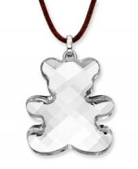 Cute and charming. Show off your playful side with Swarovski's Teddy Mini Pendant. Featuring a clear crystal silhouette, it includes a brown cotton cord as well as a secure lobster clasp and extender chain set in silver tone mixed metal. Approximate length: 15 inches + 2-inch extender. Approximate drop: 1-1/4 inches.