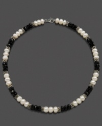 Light and dark, juxtaposed perfectly. Triplets of cultured freshwater pearl (8-9 mm) and faceted onyx beads (8 mm) alternate with sterling silver beads to create a stunning necklace. Set in sterling silver. Approximate length: 18 inches. Light and dark, juxtaposed perfectly. Triplets of cultured freshwater pearl (8-9 mm) and faceted onyx beads (8 mm) alternate with sterling silver beads to create a stunning necklace. Set in sterling silver. Approximate length: 18 inches.